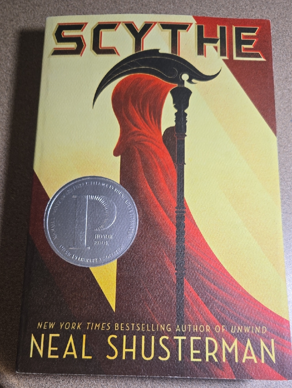 Scythe Hardcover Book - Red and Yellow Cover